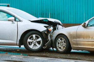 car collision accident on street. Two cars crashed in front